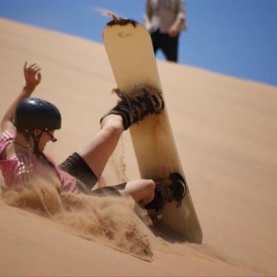 Private Desert Sandboarding Camel riding tour