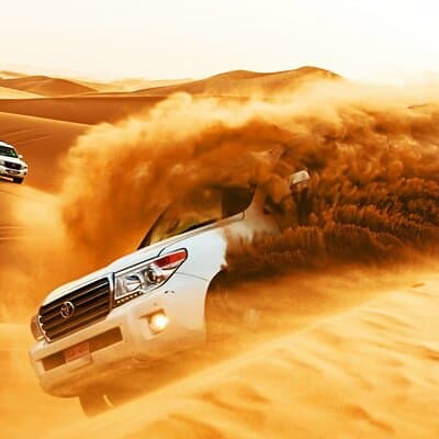 Dubai Desert Safari with Dune Bashing, Camel rides & BBQ Dinner