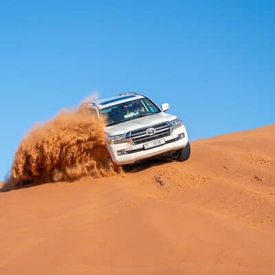 Evening Desert Safari in Dubai with Dune Bashing , Camel Ride and BBQ Dinner