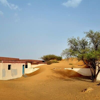 The Ghost Village Safari Tour with Dune Bashing and Sandboarding
