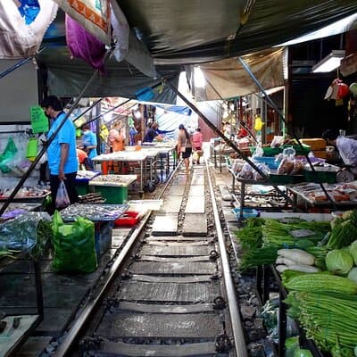 Meet Thai locals and tour Maeklong Railway Market with lunch