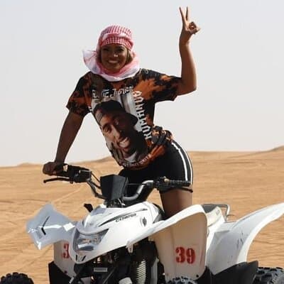 Dubai Desert Safari with Quad Bike, Camel Ride, Sandboard and BBQ 3