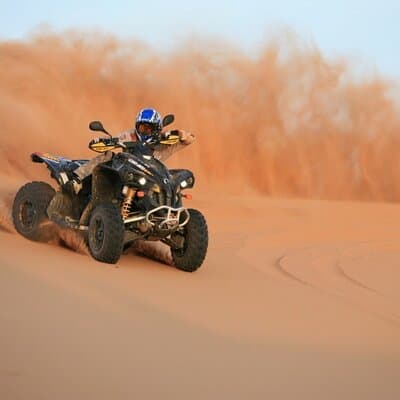 30 Min Quad Biking Tour In Dubai With Camel Ride & Sand Boarding