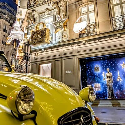 The magical illuminations of Christmas in Paris in an antique car!