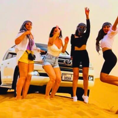 Sunset Evening Desert Safari with Dune Bashing Camel Ride & BBQ 3